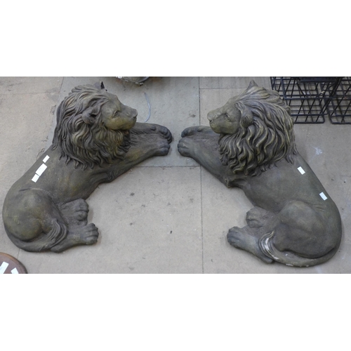 316 - A pair of concrete garden figures or recumbent lions