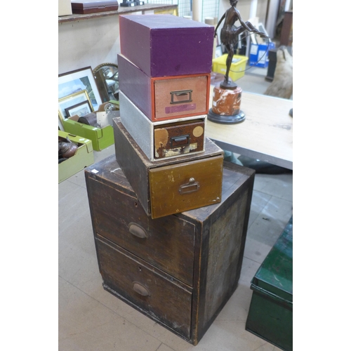 319 - An oak two drawer chest and four small index drawer cabinets