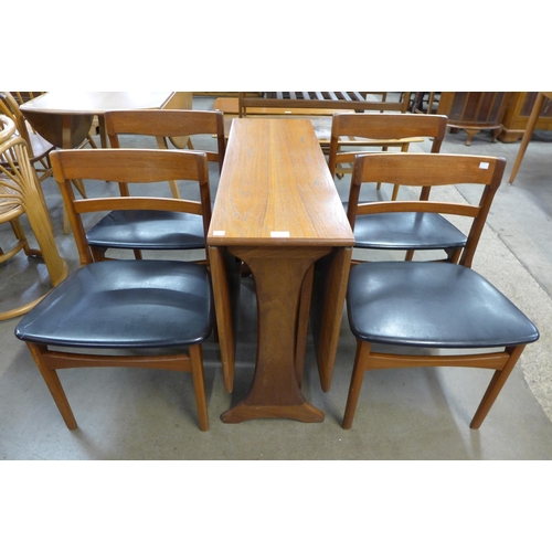 32 - A G-Plan Fresco teak drop leaf table and four teak dining chairs