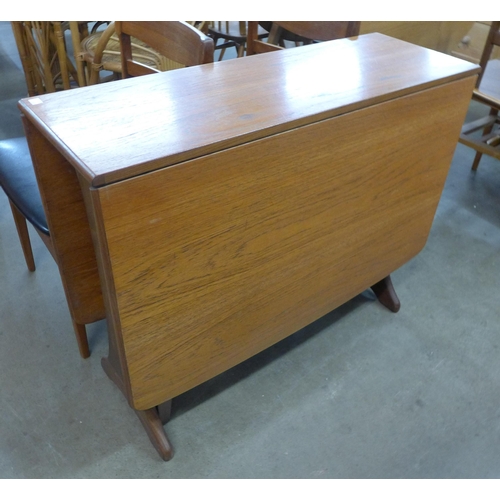 32 - A G-Plan Fresco teak drop leaf table and four teak dining chairs