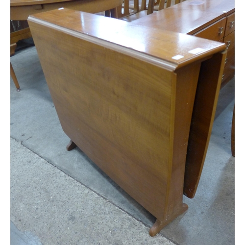 33 - A teak drop-leaf table