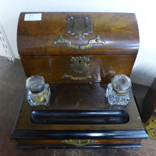 345 - A Victorian walnut and brass mounted tea caddy and a desk stand