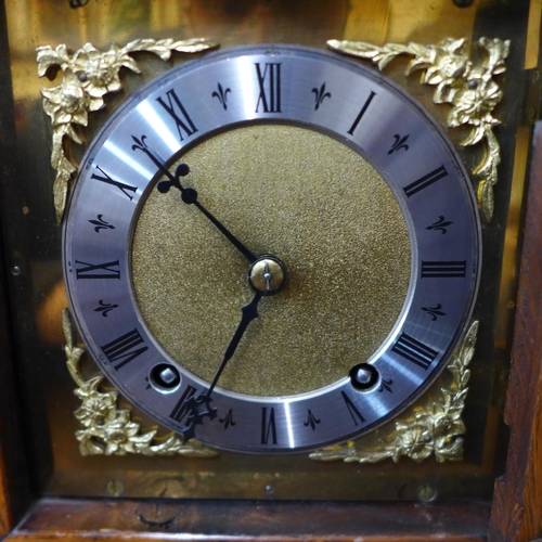 350 - An early 20th Century carved oak mantel clock, marked Hitchcock & Son, Market Place, Bingham