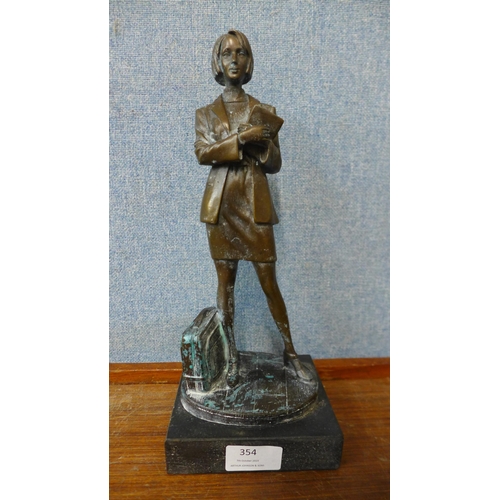 354 - A bronze figure of a female office worker