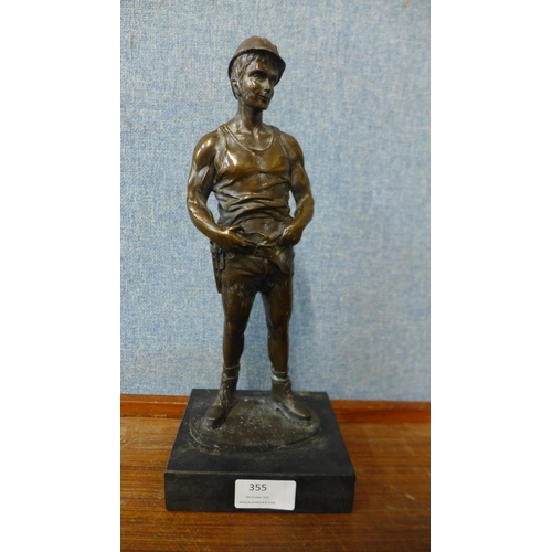 355 - A bronze figure of a miner