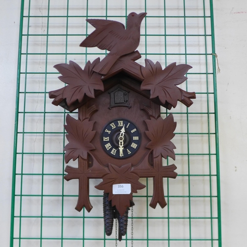 356 - A West German carved wood effect cuckoo clock