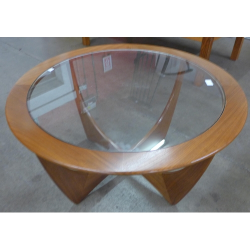 4 - A G-Plan Astro teak and glass topped circular coffee table