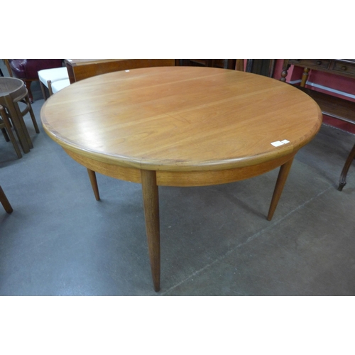 43 - A G-Plan Fresco teak circular extending dining table