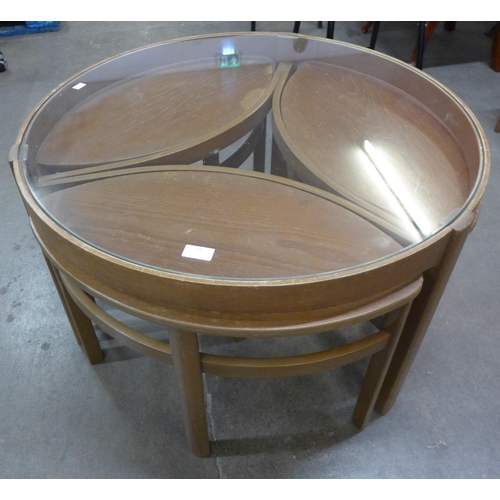 49 - A Nathan Trinity teak and glass topped circular nest of tables