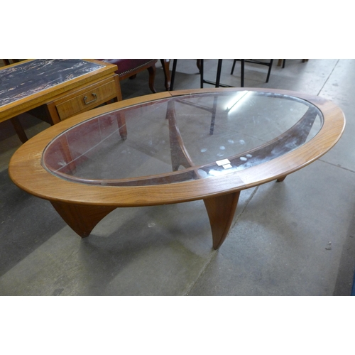 53 - A G-Plan Astro teak and glass topped oval coffee table, a/f