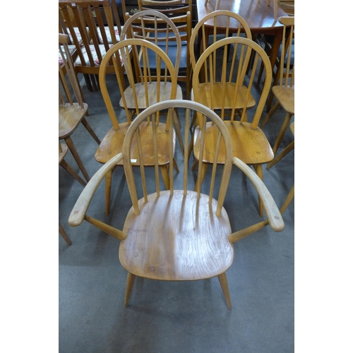 55 - A set of five Ercol Blonde elm and beech Windsor chairs