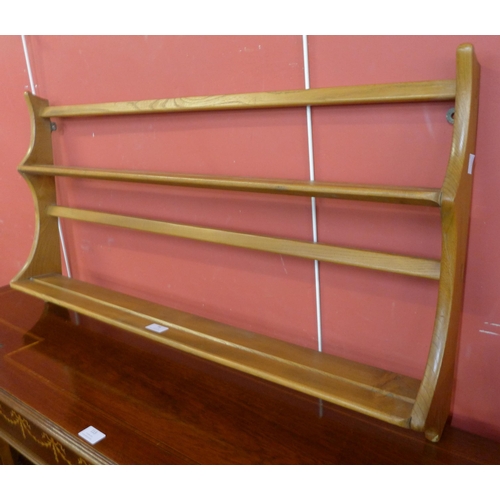 56 - An Ercol Blonde beech plate rack