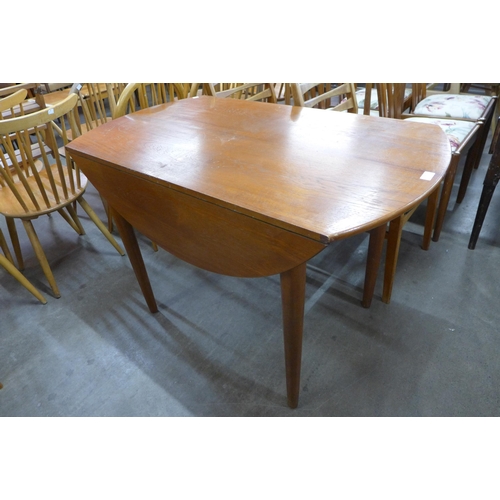 60 - A teak drop leaf table and four chairs