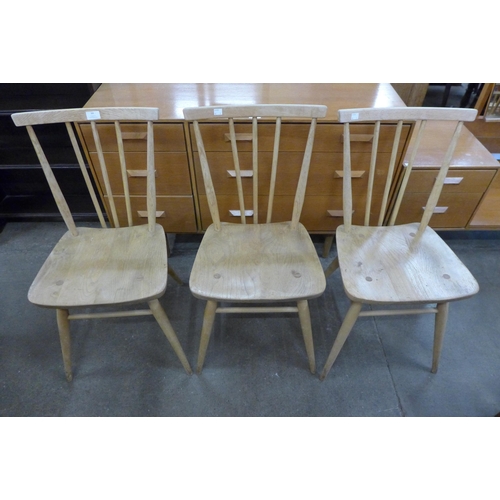 64 - A set of three Ercol Blonde elm and beech 391 model chairs