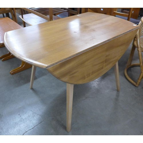 69 - An Ercol Blonde elm and beech Windsor drop-leaf table