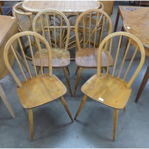 70 - A set of four Ercol Blonde elm and beech Windsor chairs