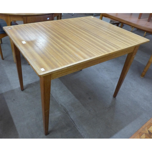 77 - A Gordon Russell walnut extending dining table