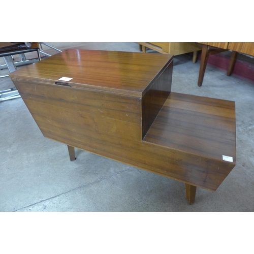 83 - A Vanson tola wood sewing table