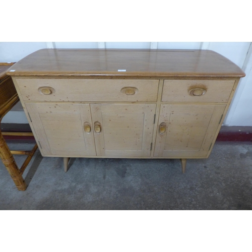 87 - An Ercol Blonde elm and beech Windsor sideboard