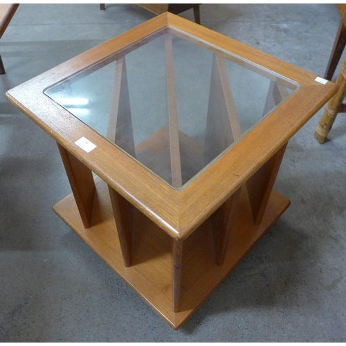 91 - A teak and glass topped coffee table/record cabinet