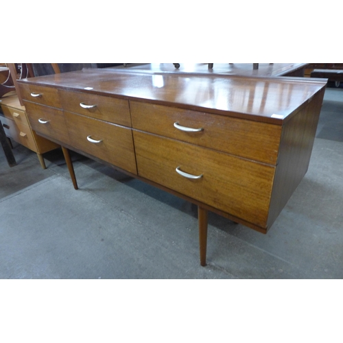 99 - A tola wood six drawer sideboard