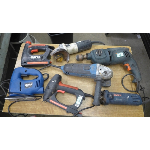 2044 - A box of electrical tools, a/f including black and decker drill jig saw grinder and staple guns