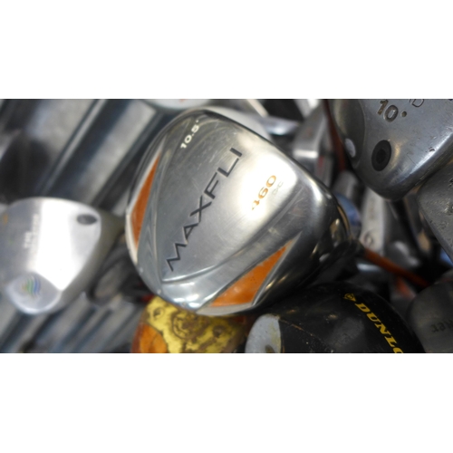 2232 - A Selection of gold clubs including woods irons and putters