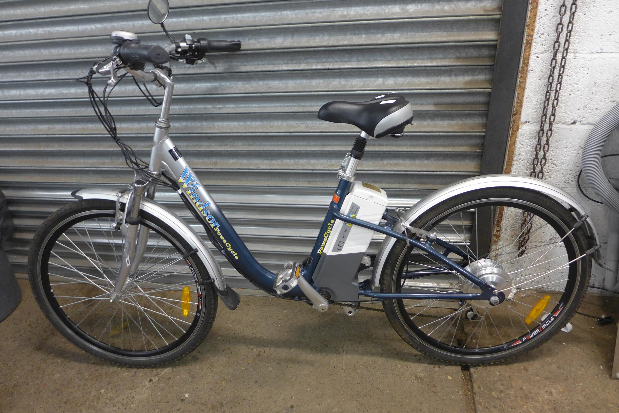 A Windsor Powacycle electric bike with keys and battery