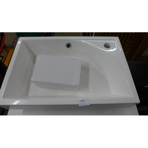 2300 - A bathroom vanity unit with 2 sinks and a tap