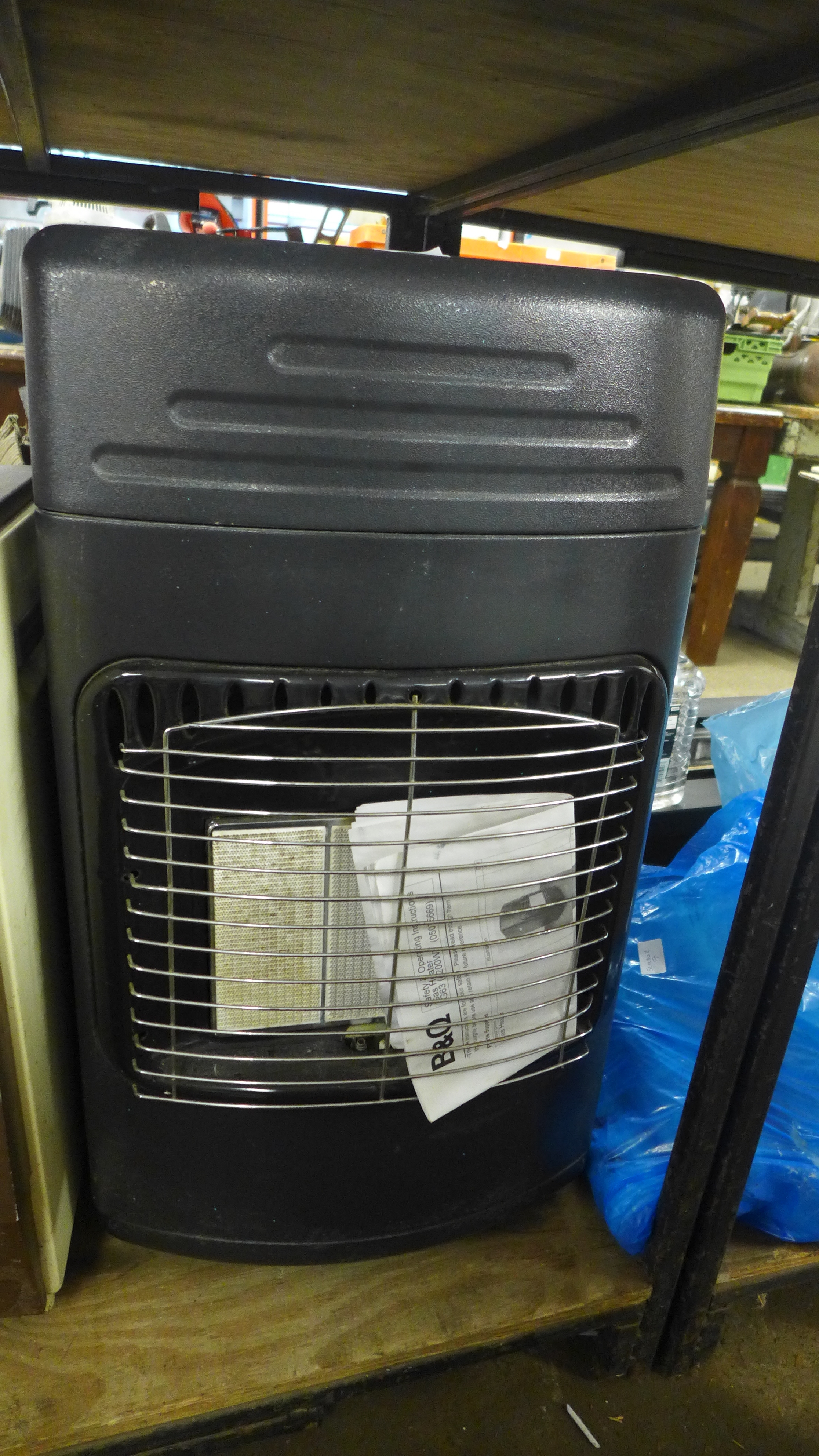 A portable gas fire Bu0026Q 42watt output with full gas bottle W