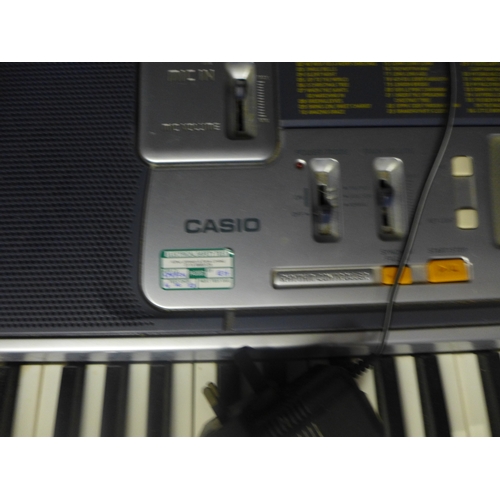 2186 - A Casio keyboard and stand