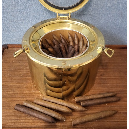 348 - A brass ships porthole cigar container, with approx. thirty five cigars