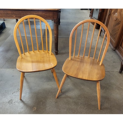 64A - A pair of Ercol Blonde elm and beech Windsor chairs