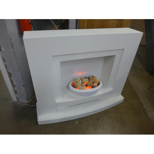 1530 - A white electric fire and surround