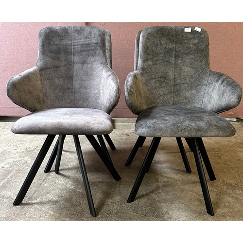 1560 - Four grey upholstered dining chairs  * This lot is subject to VAT