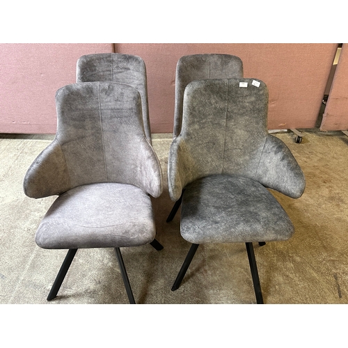 1560 - Four grey upholstered dining chairs  * This lot is subject to VAT