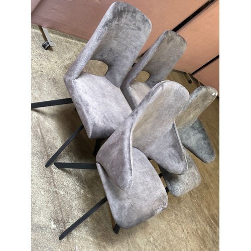 1560 - Four grey upholstered dining chairs  * This lot is subject to VAT