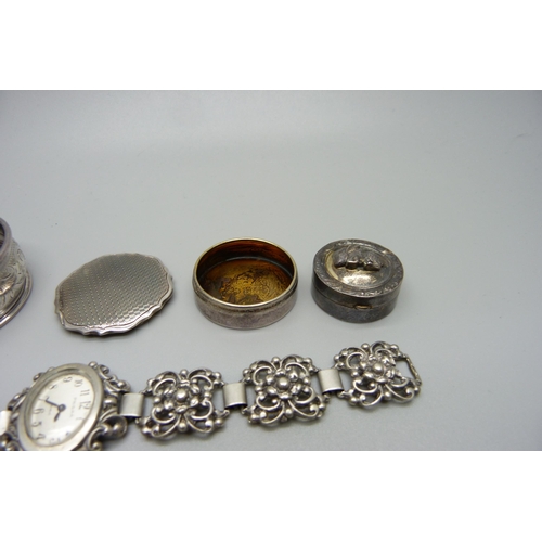 1011 - A hallmarked silver pill box, Birmingham 1933, a lady's Prima 835 silver cocktail wristwatch, a silv... 