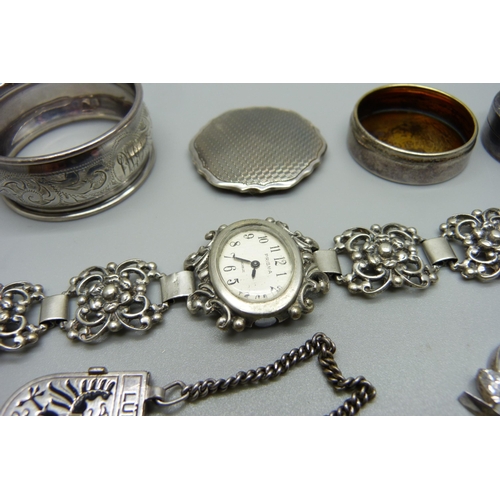 1011 - A hallmarked silver pill box, Birmingham 1933, a lady's Prima 835 silver cocktail wristwatch, a silv... 