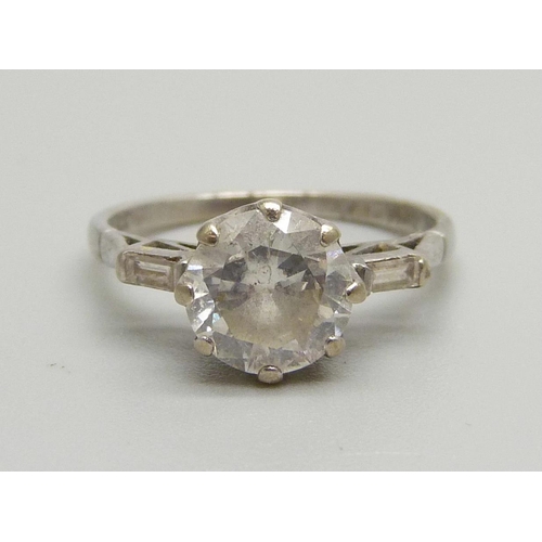 1016 - An 18ct white gold set 1.5 carat diamond ring, the shoulders each set with a baguette diamond, 3g, M