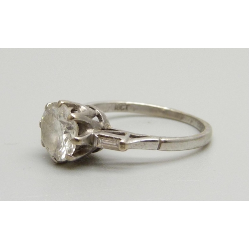 1016 - An 18ct white gold set 1.5 carat diamond ring, the shoulders each set with a baguette diamond, 3g, M