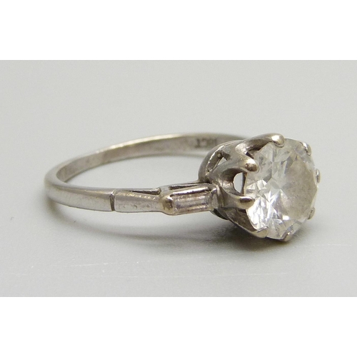 1016 - An 18ct white gold set 1.5 carat diamond ring, the shoulders each set with a baguette diamond, 3g, M