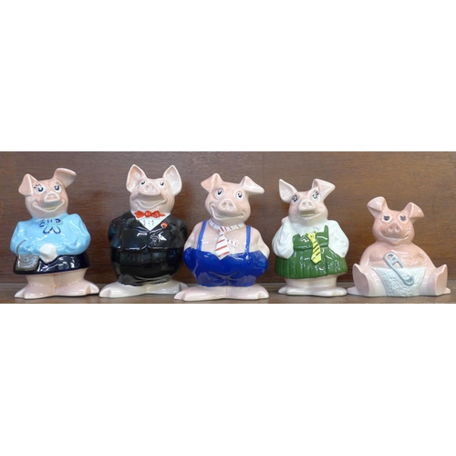 602 - A set of five Wade Nat West piggy banks with stoppers