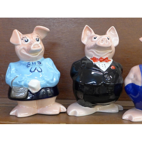 602 - A set of five Wade Nat West piggy banks with stoppers