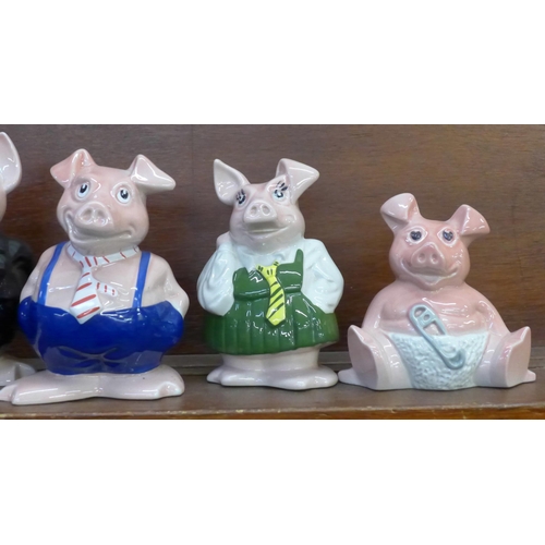 602 - A set of five Wade Nat West piggy banks with stoppers