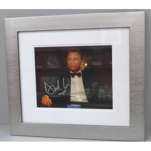 605 - A Daniel Craig signed photograph with Certificate of Authentication