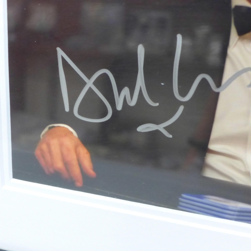 605 - A Daniel Craig signed photograph with Certificate of Authentication