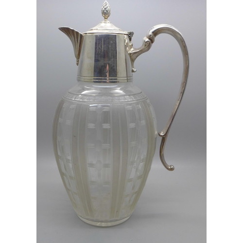 607 - A claret jug with silver plated top