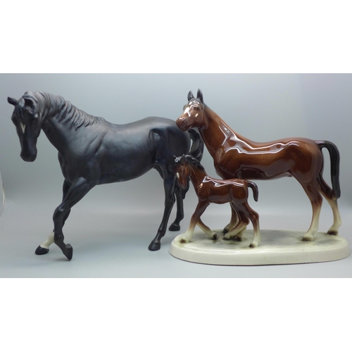 610 - A Beswick horse, Black Beauty and one other horse and foal group