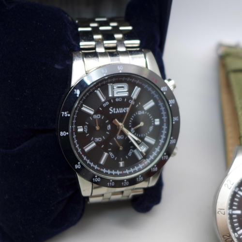 611 - Four wristwatches; Stauer, Timex Expedition, Sekonda and Cannibal